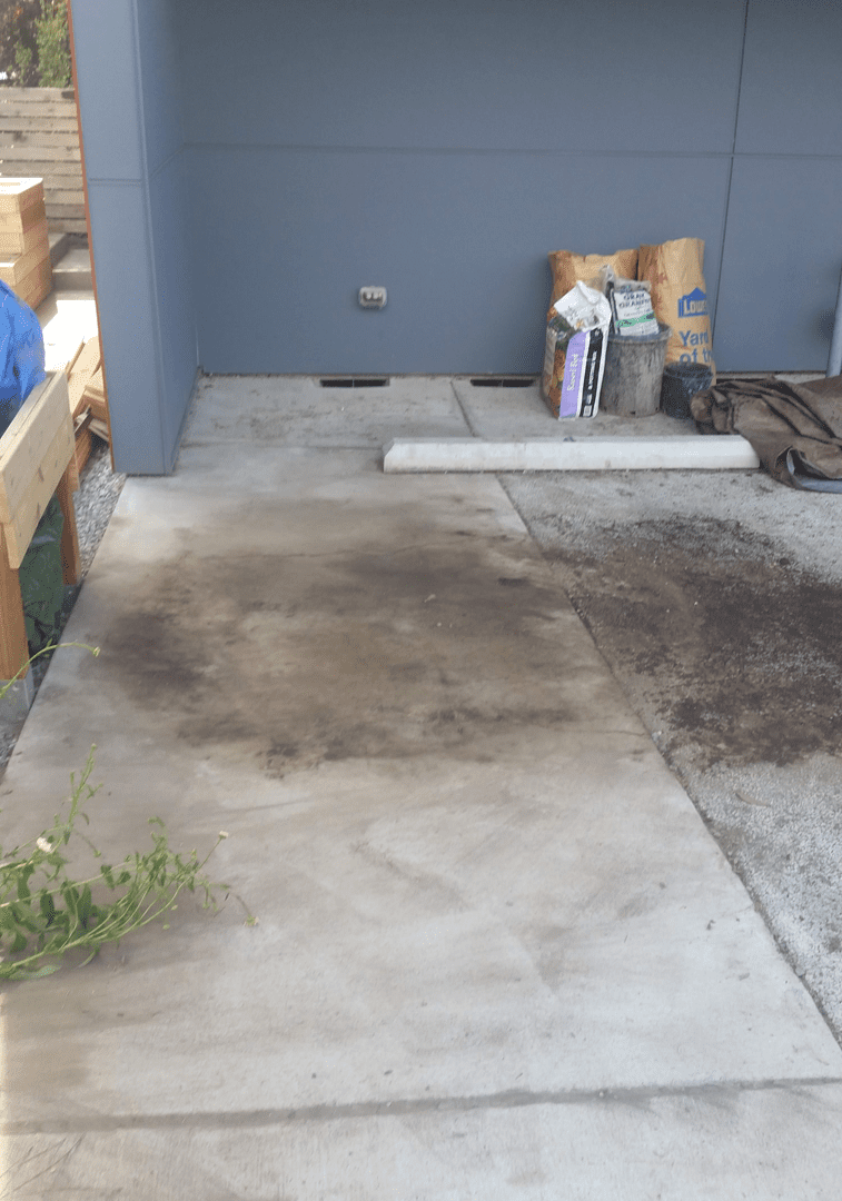 Dirt pile and construction debris on concrete surface in Seattle, illustrating junk removal services by Seattle Rubbish Removal.